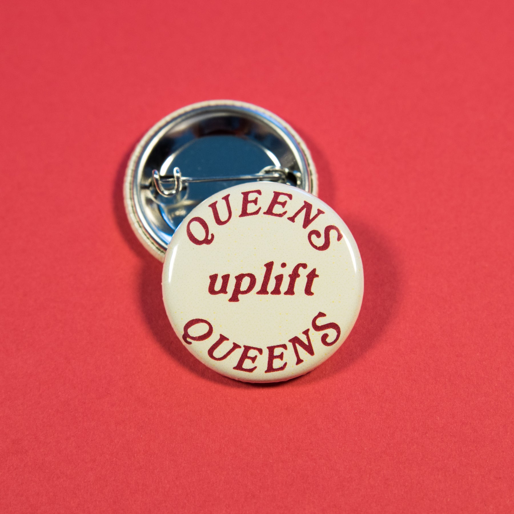 Queens Uplift Queens Button